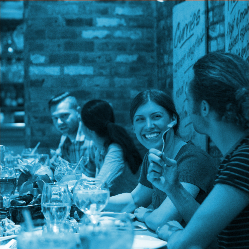 Binn Group Trade sector banner. People chatting and enjoying dinner at a restaurant