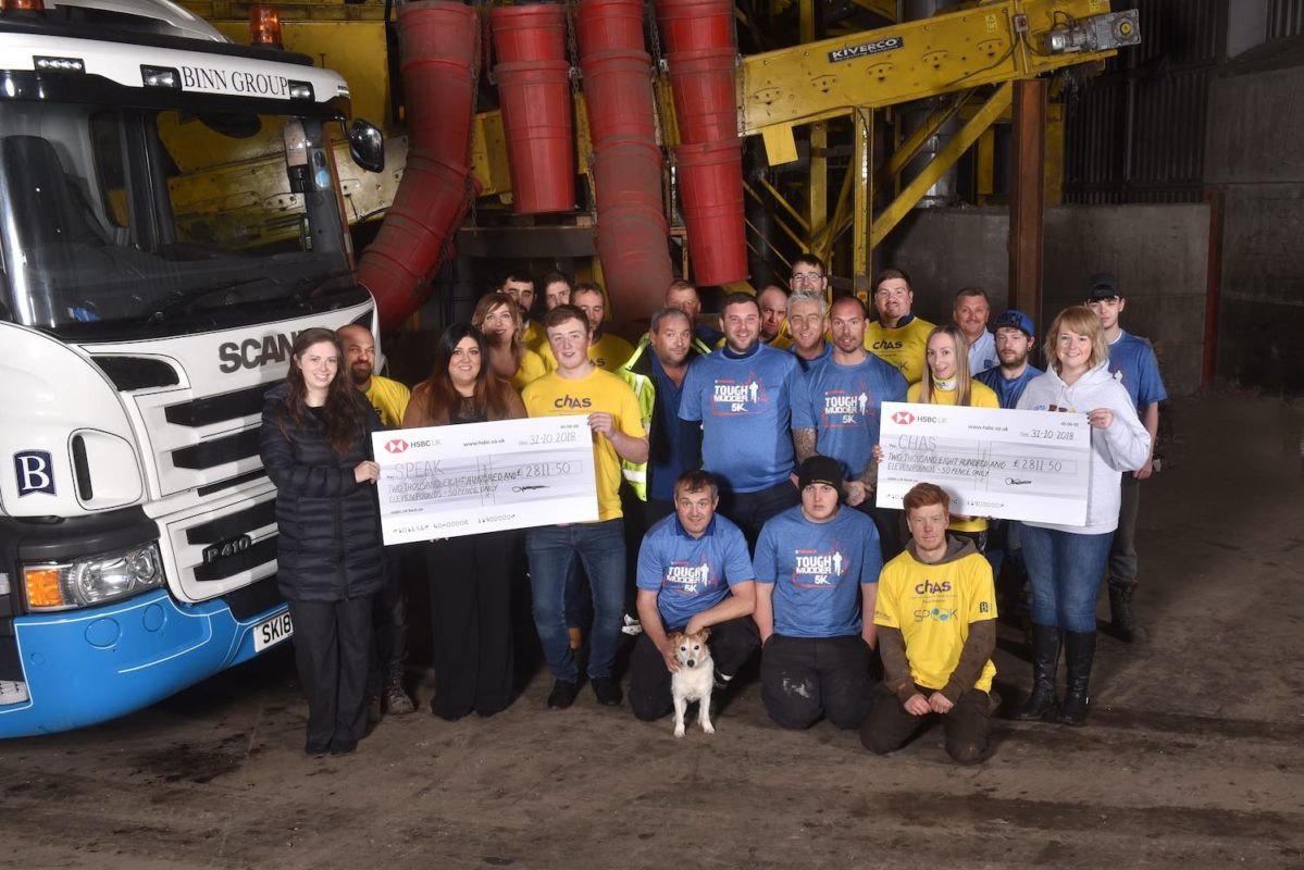 Binn Group hand over cheques to CHAS and SPEAK